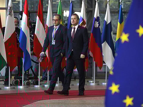 Luxembourg's Prime Minister Xavier Bettel (R) arrives on December 13, 2018 in Brussels for a European Summit aimed at discussing the Brexit deal, the long-term budget and the single market.