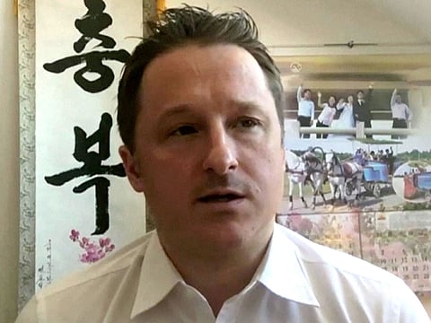 In this image made from video taken on March 2, 2017, Michael Spavor, director of Paektu Cultural Exchange, talks during a Skype interview in Yangi, China. 