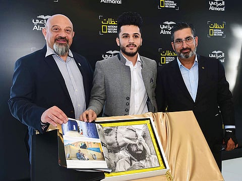 From left: Hussam R. Abdul Qader, CMO, Almarai, and  Sanjay Raina, General Manager and Senior Vice-President of Fox Networks Groups, and Mohammad Al Baraway, winner Moments photography contest.