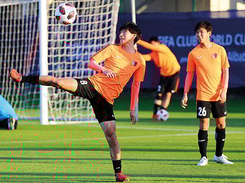 Japan’s Kashima Antlers players warm up during a training session at the Khalifa Bin Zayed stadium in Al Ain.