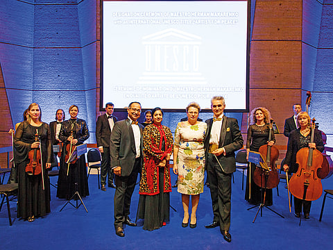 Suvra Chakraborty (left) and Herman Makerendo with the award-winning Kyiv Classic Orchestra. 