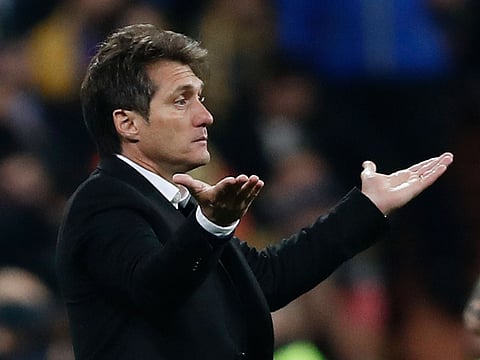 Guillermo Barros Schelotto, coach of Argentina's Boca Juniors, gestures during the Copa Libertadores final soccer match against Argentina's River Plate at the Santiago Bernabeu stadium in Madrid, Spain, Sunday, Dec. 9, 2018.