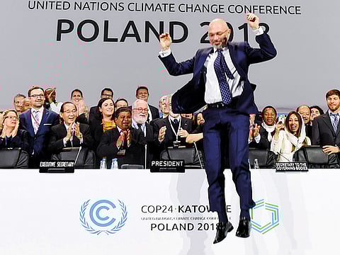 COP24 president Michal Kurtyka celebrates at the end of the final session of the COP24 summit on climate change in Katowice, southern Poland