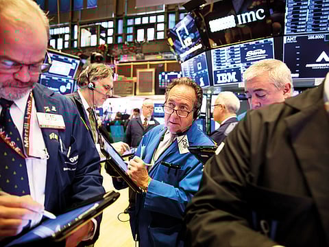 Traders at the New York Stock Exchange. Volatility continues to grip financial markets amid mounting concern over the health of the global economy.