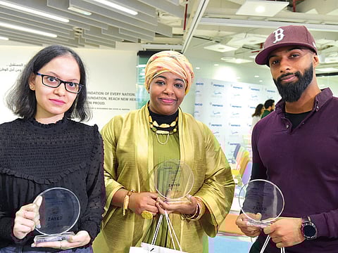 Winners from left to Right: Nidhi Jhaveri (Poetry category), Bwader El Hassan (Art category) and Khalifa Al Remethi (Music Category) at the Art of Zayed competition to encourage talented UAE residents to commemorate the Year of Zayed through music, poetry, and artwork