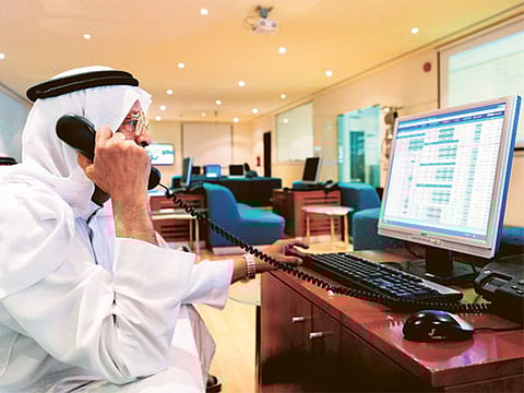 An investor monitors Saudi stocks. Saudi Arabian supermarket retailer BinDawood Holding has priced its initial public offering at 96 riyals ($25.59) a share, the company said on Wednesday.