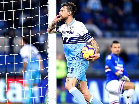 Lazio's Francesco Acerbi celebrates after scoring his side's opening goal during the Serie A soccer match between Lazio and Sampdoria at the Olympic stadium in Rome