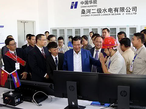 Cambodia's Prime Minister Hun Sen (C) inaugurates the 400 megawatt Lower Sesan 2 hydropower plant during a ceremony in Stung Treng province.