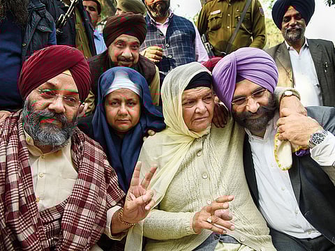 From left: Delhi Sikh Gurdwara Management Committee President Manjit Singh GK, Nirpreet Kaur and Jagdish Kaur, whose kin were killed during 1984 anti-Sikh riots and Akali Dal MLA Manjinder Singh Sirsa react after Kumar’s conviction.