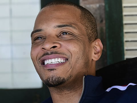 In this Sept. 14, 2018, file photo shows rapper Clifford Harris Jr., better known as T.I., on the porch of his grandparents' home where he grew up in Atlanta. 