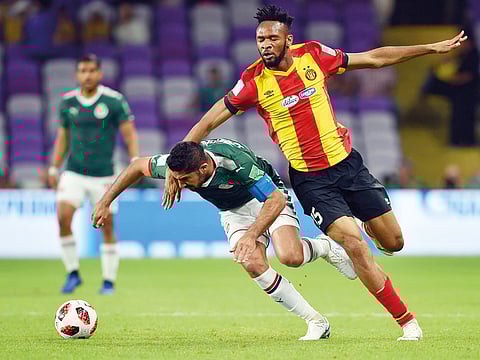 ES Tunis (in red) and Guadalajara players vie for the ball during the Fifa Club World Cup fifth-place playoff. 