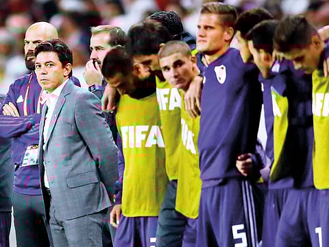 River Plate coach Marcelo Gallardo with players and backroom staff during the penalty shootout.
