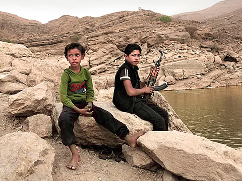 A 17-year-old boy with his AK-47 in High Dam in Marib. Experts say child soldiers are “the firewood” in the inferno of Yemen’s civil war, trained to fight, kill and die on the frontlines.