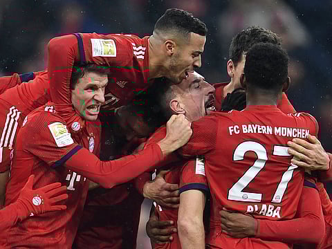 Bayern Munich's Franck Ribery celebrates scoring their first goal with team mates.