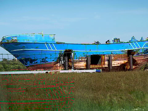 , the wrecked fishing boat that capsized and sunk on April 18, 2015 off the coast of Libya, lies outside a NATO base in the Sicilian town of Mellili, Italy. One of the two investigators on the project tracing families and survivors in Africa, has confirmed that the boat that sank on April 18, 2015 carried not 800 migrants as previously believed, but as many as 1,100. 