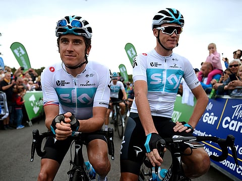 Britain's Chris Froome (R) and Geraint Thomas (L) of Team Sky prior to the start of the first stage of the Tour of Britain cycle race in Pembrey Country Park, south Wales on September 2, 2018. 