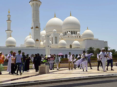 Tourists visit the Shaikh Zayed Grand Mosque in Abu Dhabi.