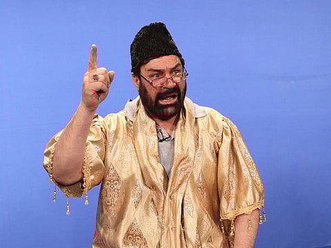In this photograph taken on January 30, 2013, Afghan comedian Hanif Hamgam performs a scene for the comedy television show Zang Khatar (The Dangerous Bell) on Afghanistan's largest private TV channel Tolo in Kabul. 