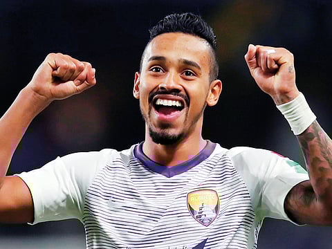 Al-Ain's Caio celebrates winning the penalty shootout.  