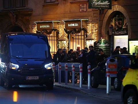Police officers secure the area as a coffin is being transported at the site of a shooting in downtown Vienna, Austria December 21, 2018. 