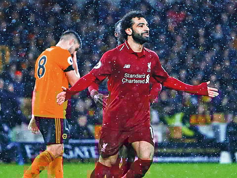 Liverpool’s midfielder Mohammad Salah celebrates after scoring the opening goal against Wolverhampton on Friday.