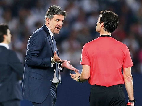 Al Ain coach Zoran Mamic argues with a linesman during the final at the Zayed Sport City in Abu Dhabi.