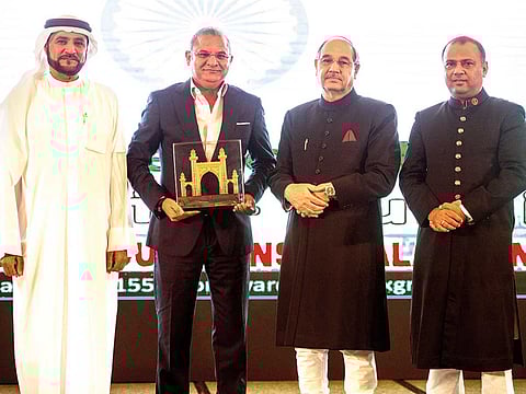 Tariq Chauhan after receiving the CEO Global Award from Dr Rashid Allem, chairman of Sewa, in the presence of Tariq Mansoor and Pushkin Agha at the awards ceremony in Dubai.