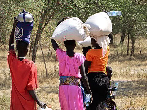 Women and girls walk back after getting food in Bentiu, near Nhialdu in South Sudan. Photo for illustrative purposes only.