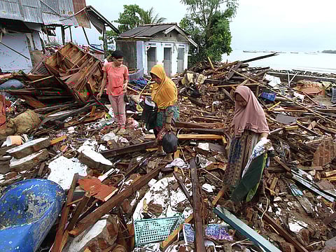 Residents search through debris in Tanjung Lesung, Banten province on December 24, 2018, two days after a tsunami - caused by activity at a volcano known as the "child" of Krakatoa - hit the west coast of Indonesia's Java island.