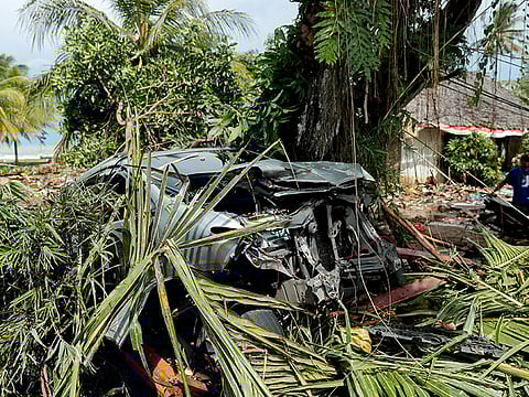 A destroyed car is seen after a tsunami hit an area in Tanjung Lesung, Banten province, Indonesia, December 24, 2018. 