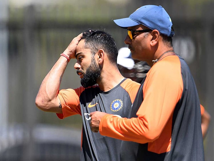Virat Kohli (L) and coach Ravi Shastri