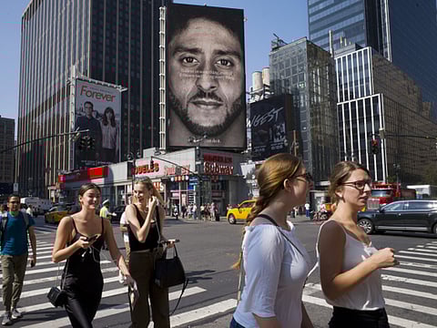 File picture of a Nike ad in New York featuring Colin Kaepernick. The ad's theme of "Nelieve in something, even if it means sacrificing everything" angered some.