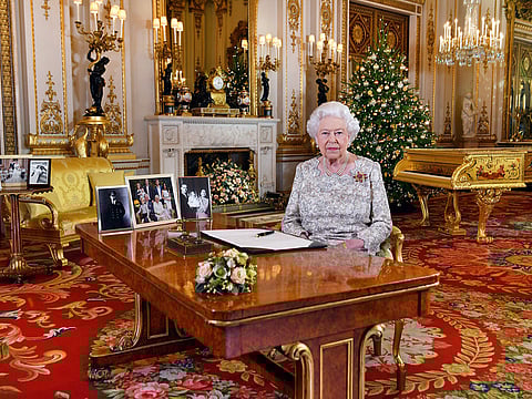 Britain's Queen Elizabeth poses for a photograph after she recorded her annual Christmas Day message, in the White Drawing Room of Buckingham Palace, London.