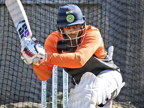 India's batsman Hanuma Vihari sweeps a ball during a training session in Melbourne on December 25, 2018, ahead of the third cricket Test match between Australia and India. 