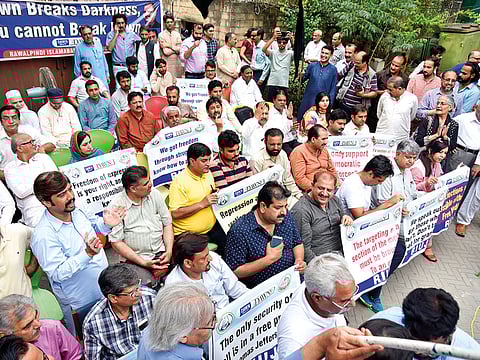 Journalists protest against lay-offs from newspapers in Islamabad. In the last two months, hundreds of journalists have been laid off as government advertising — a key source of revenue — has been drastically reduced.