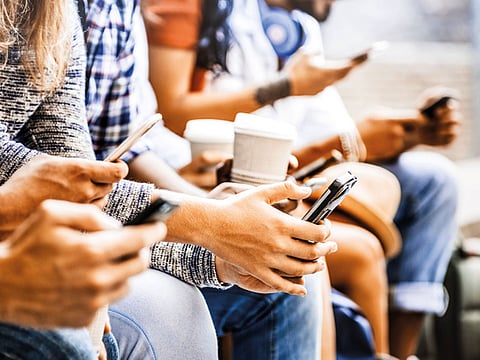 People using their mobile phones