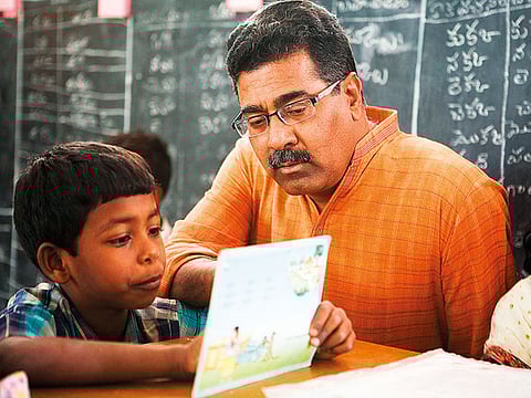 Padmanabha Rao, a leader of the Rishi Valley Institute for Educational Resources, with a student in Andhra Pradesh