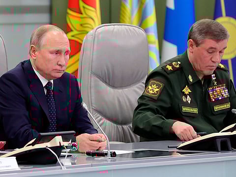 Russian President Vladimir Putin, left, and Chief of General Staff of Russia Valery Gerasimov oversee the test launch of the Avangard hypersonic glide vehicle from the Defense Ministry's control room in Moscow, Russia, Wednesday, Dec. 26, 2018.