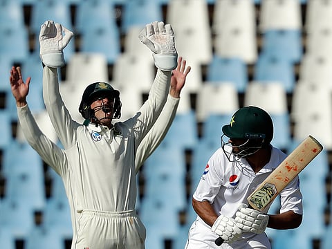 Pakistan's batsman Shan Masood, right, watches South Africa's wicketkeeper Quinton de Kock make an unsuccessful appeal for LBW on day two of the first cricket test match between South Africa and Pakistan at Centurion Park in Pretoria, South Africa, Thursday, Dec. 27, 2018. 