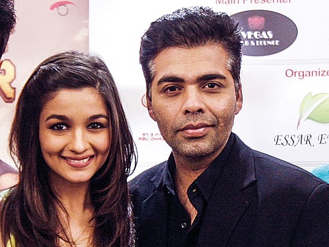 Karan Johar along with Alia Bhatt at the press conference at Jumeirah Creekside Hotel in Dubai. 