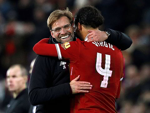 A January 5, 2018 file photo of Liverpool manager Juergen Klopp with Virgil van Dijk at the end of the match.
