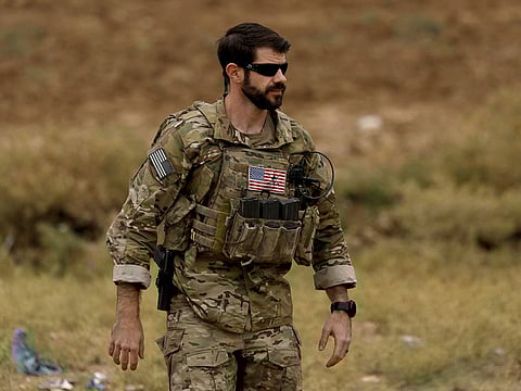 This file photo taken on November 4, 2018 shows a US soldier in the Kurdish-held town of Al-Darbasiyah in northeastern Syria bordering Turkey.