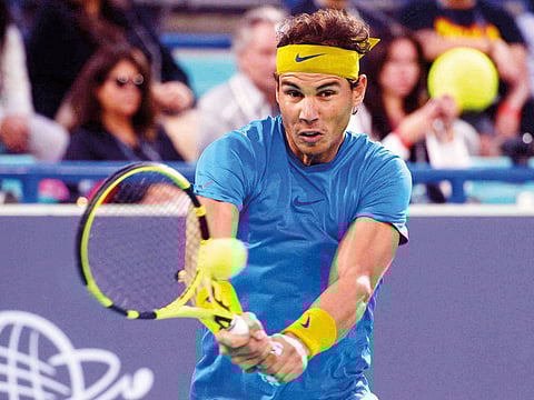 Rafael Nadal powers a forehand shot against Kevin Anderson in the semi-finals at the Abu Dhabi International Tennis Centre. 