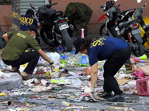 Police officers investigate at the site of an explosion outside a shopping mall in Cotabato City on the southern island of Mindanao on December 31, 2018. 