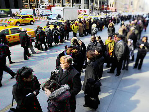 People line up for a job fair in Manhattan. As a resurgence in new cases continue to raise the risk of a deep global recession, economists now weigh how the pandemic-related implications could run deeper.