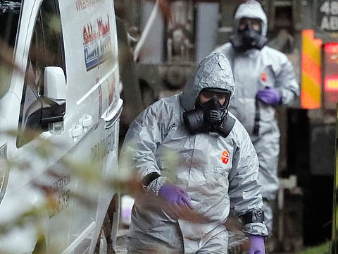 Military forces work on a van in Winterslow, England, Monday, March 12, 2018, as investigations continue into the nerve-agent poisoning of Russian ex-spy Sergei Skripal and his daughter Yulia, in Salisbury, England, on Sunday March 4, 2018.