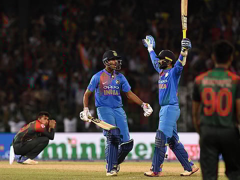 Indian cricketer Dinesh Karthik (second right) has been backed by Sunil Gavaskar to make the the team for the T20 World Cup.