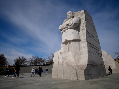 Visitors walk next to the Martin Luther King Jr. Memorial in Washington, DC 