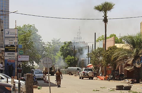 File photo: A soldier walks near the rear of the Army Headquarters in central Ouagadougou, Burkina Faso. 