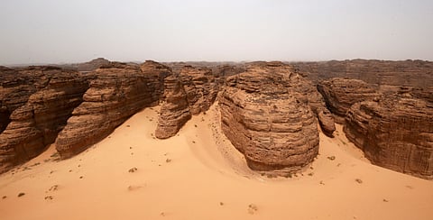 A picture taken on April 1, 2018 shows an aerial view of carved rose-coloured sandstone mountains in the desert of Al Ula in northwestern Saudi Arabia.  